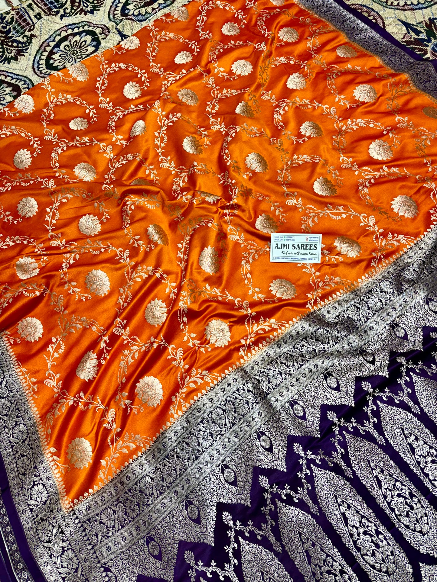 Mashru Katan Silk Orange Banarasi Saree with Contrast Violet Border and Rich Zari Floral Weaving