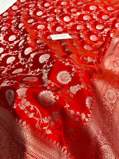 Orange Mashru Katan silk Banarasi saree with gold zari and Rupa silver Meenakari floral motifs