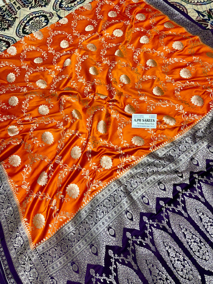 Mashru Katan Silk Orange Banarasi Saree with Contrast Violet Border and Rich Zari Floral Weaving