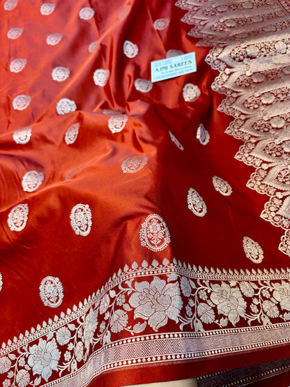 Rust orange Katan silk Banarasi saree with floral border