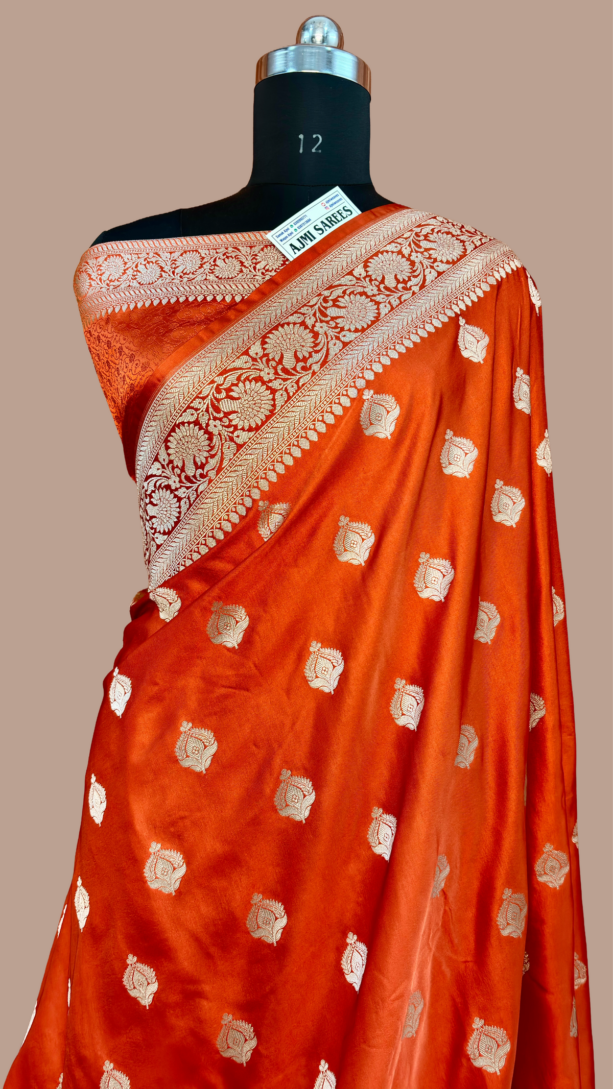 Luxury rust Katan silk Banarasi saree featuring golden zari woven buta motifs
