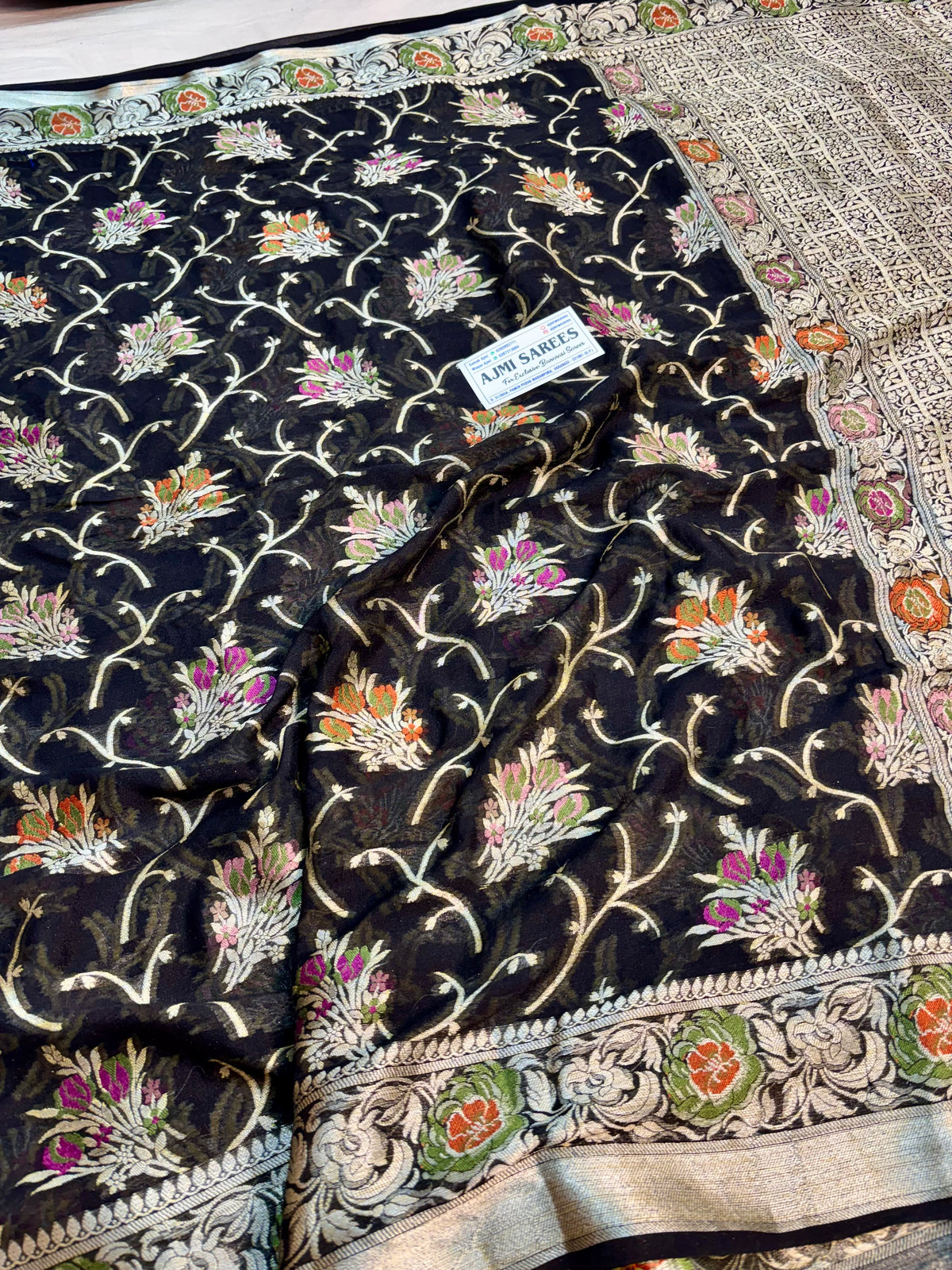 Black Banarasi Tilfi saree featuring multicolour floral motifs