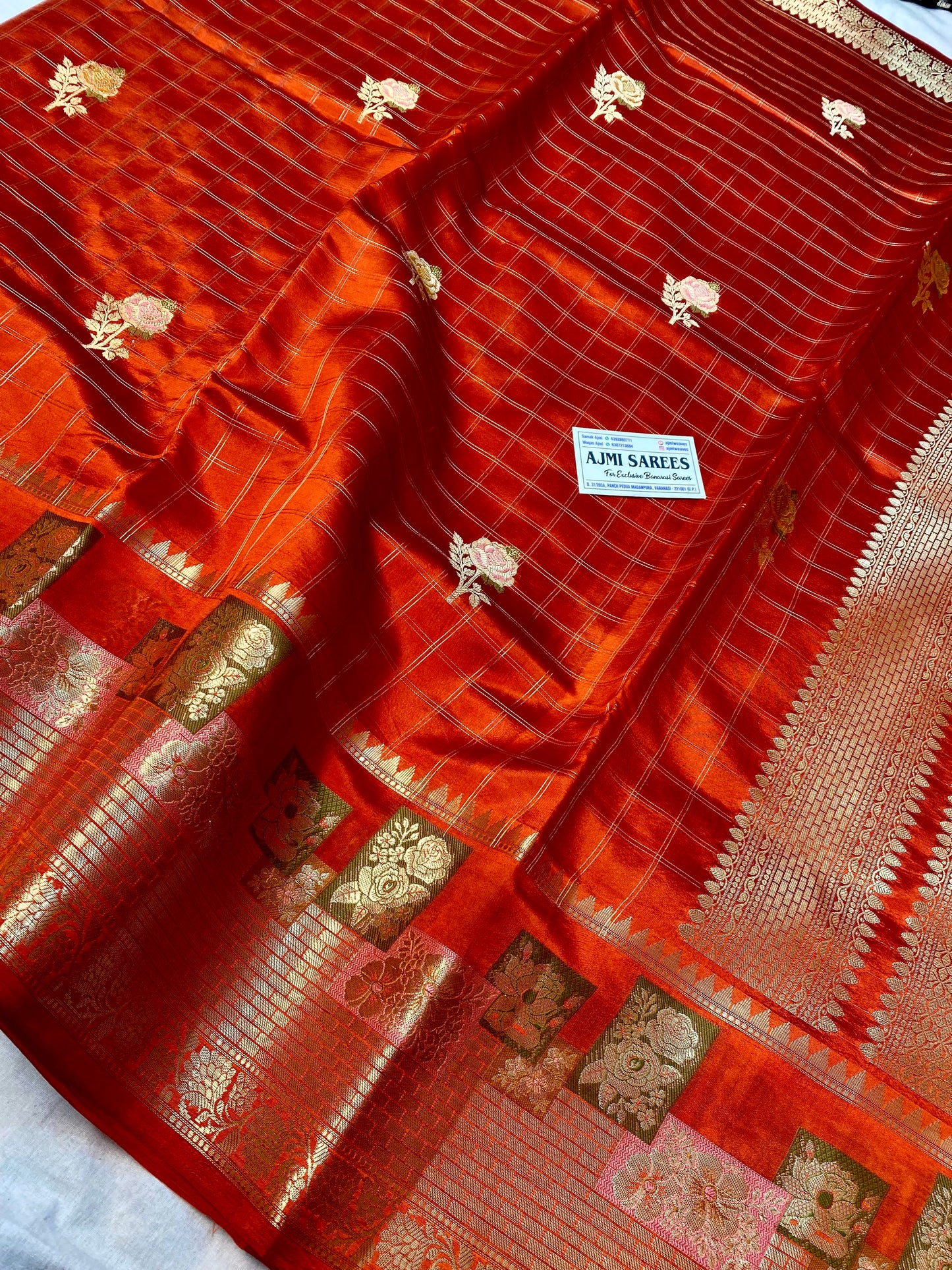 Pure silk Banarasi saree featuring Tilfi border and floral butas