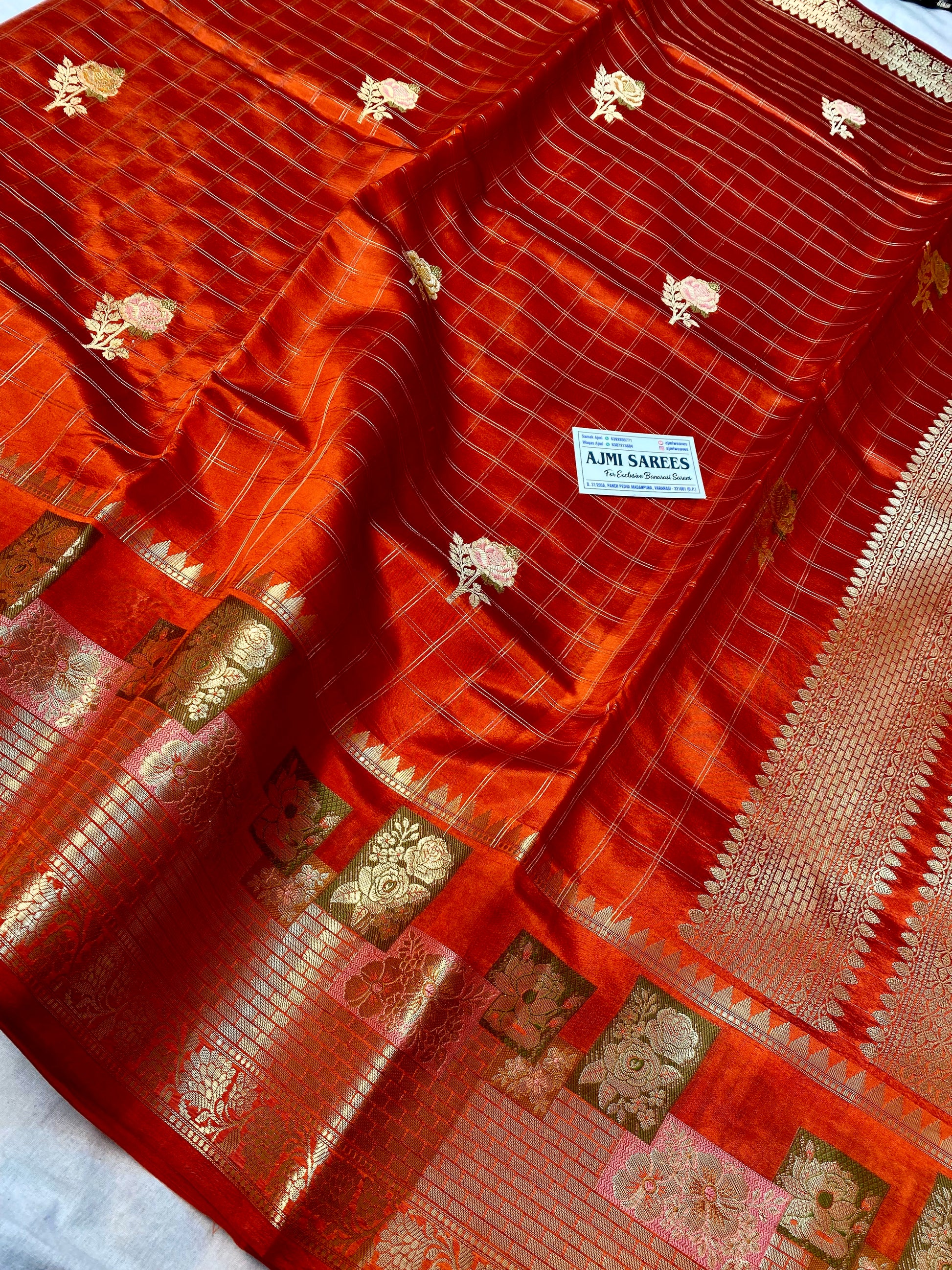 Pure silk Banarasi saree featuring Tilfi border and floral butas
