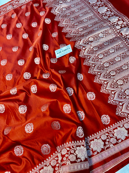 Traditional rust orange Banarasi saree with zari buta motifs