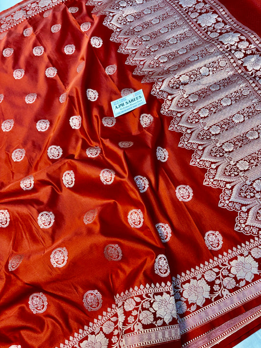 Traditional rust orange Banarasi saree with zari buta motifs