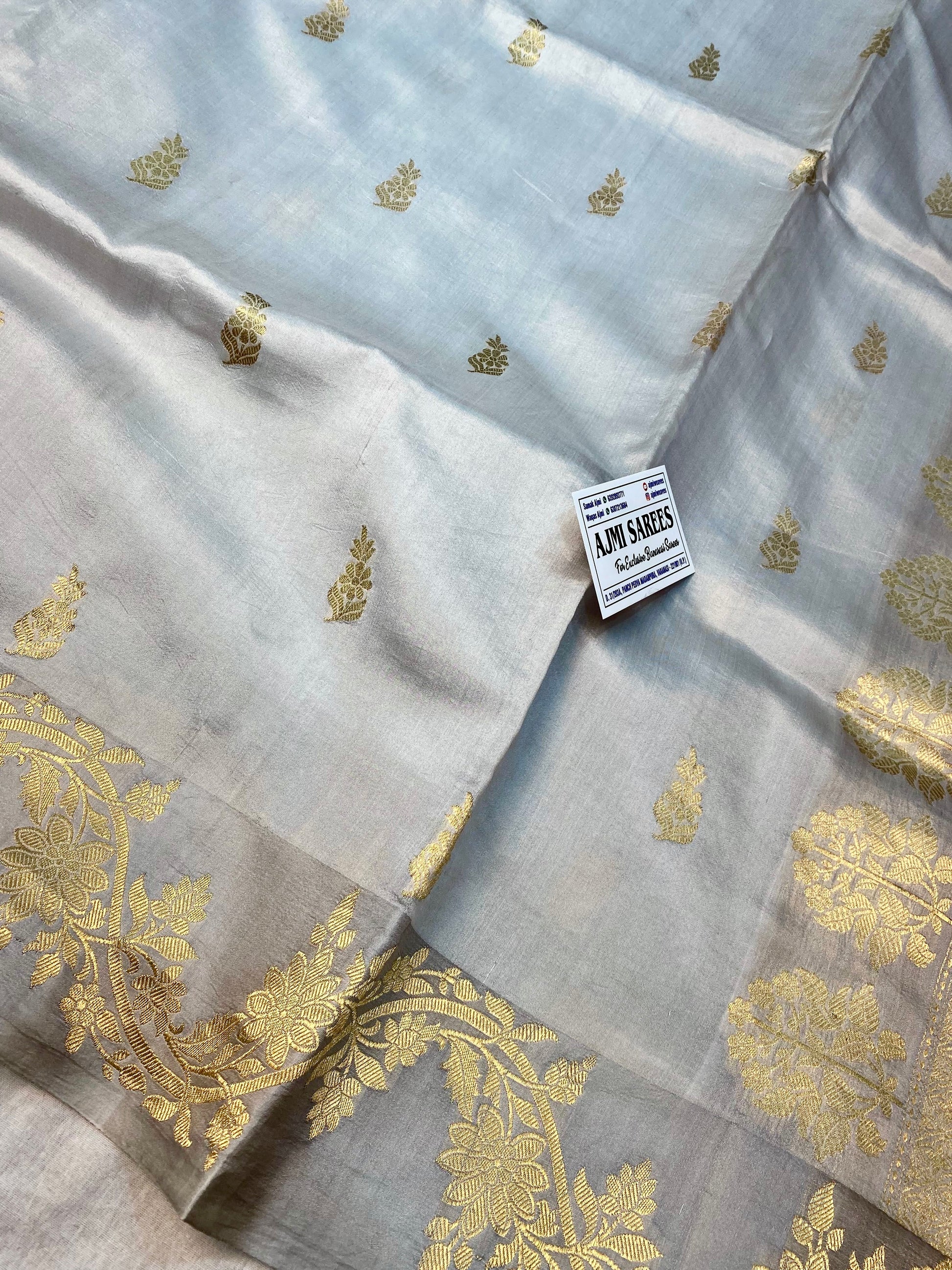 Light grey Banarasi saree with all-over Kadwa motifs and satin border