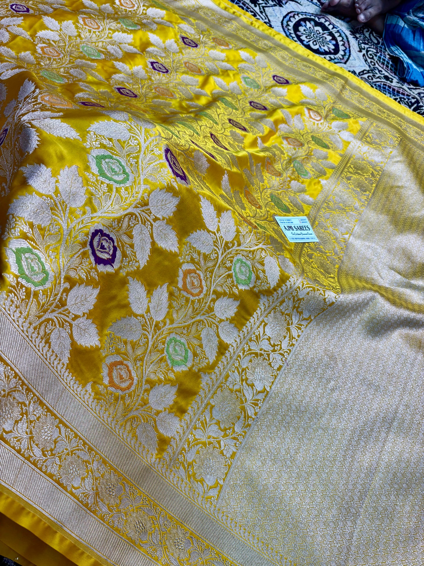 yellow banarasi saree meenakari floral design close up