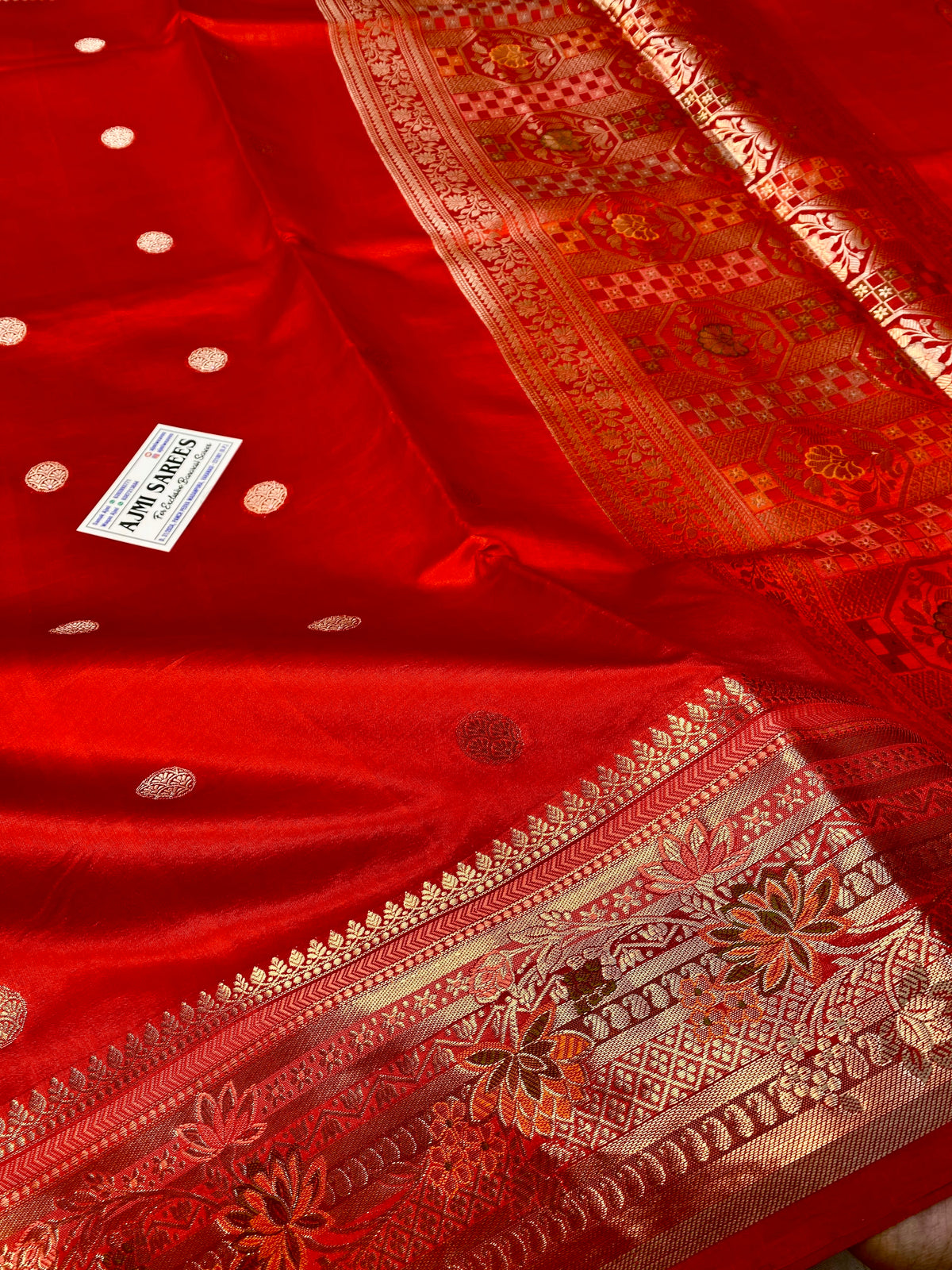 Pure orange Banarasi silk saree with Tilfi zari border and Meenakari butis