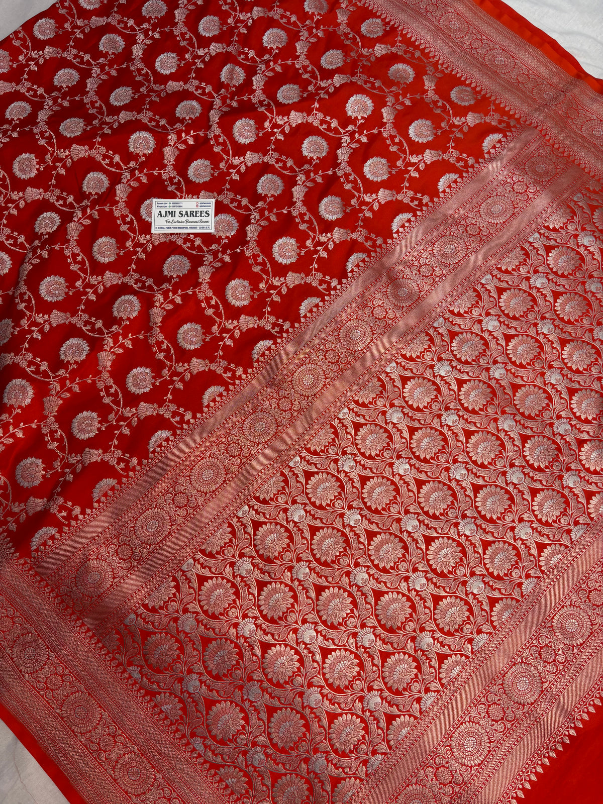 Orange Mashru Katan silk saree with intricate gold zari and silver Rupa Meenakari floral vines