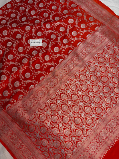 Orange Mashru Katan silk saree with intricate gold zari and silver Rupa Meenakari floral vines