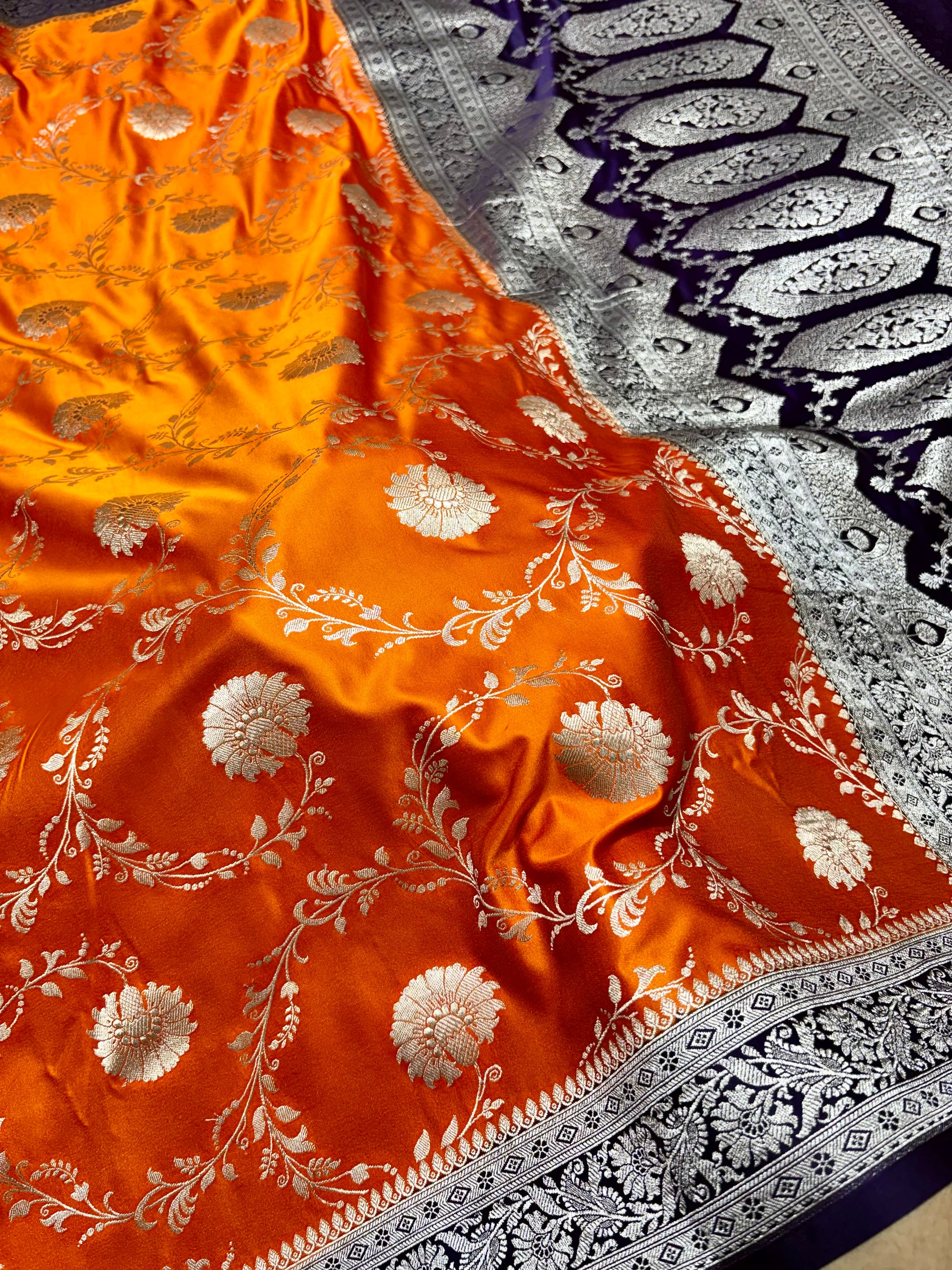 Mashru Katan Silk Orange Banarasi Saree with Contrast Violet Border and Rich Zari Floral Weaving