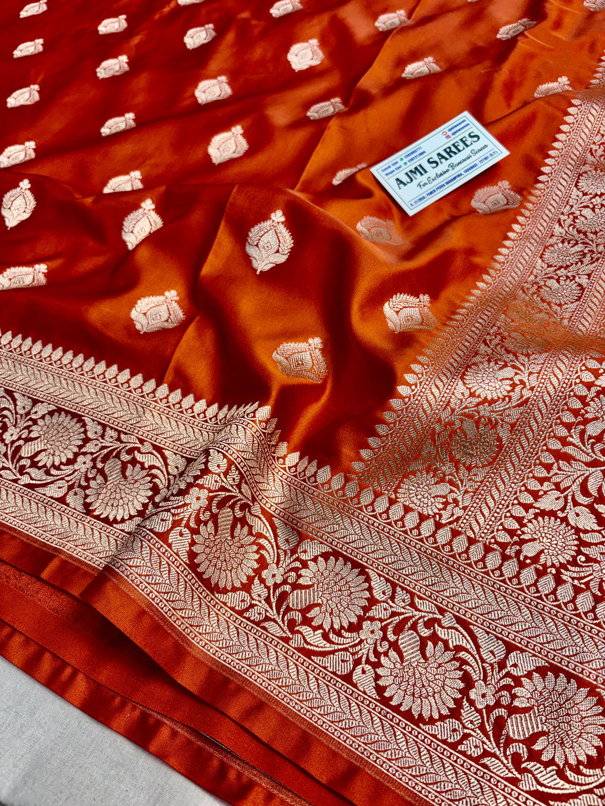 Luxury wedding saree in rust Mashru Katan silk with golden zari motifs