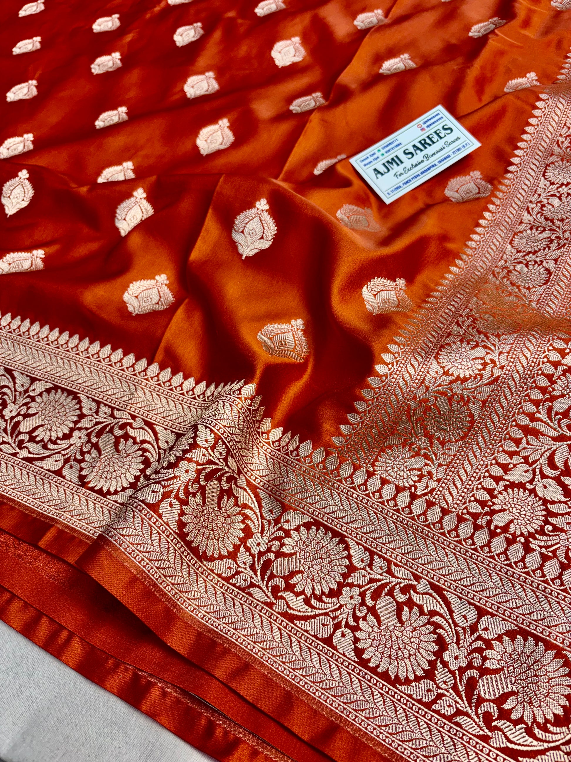 Luxury wedding saree in rust Mashru Katan silk with golden zari motifs