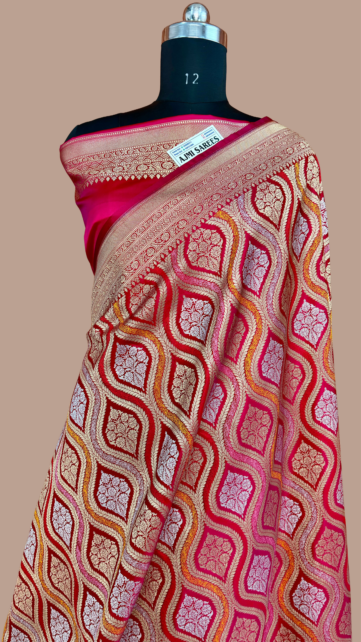 Wedding wear hot pink Banarasi silk saree with intricate floral zari work and rich border