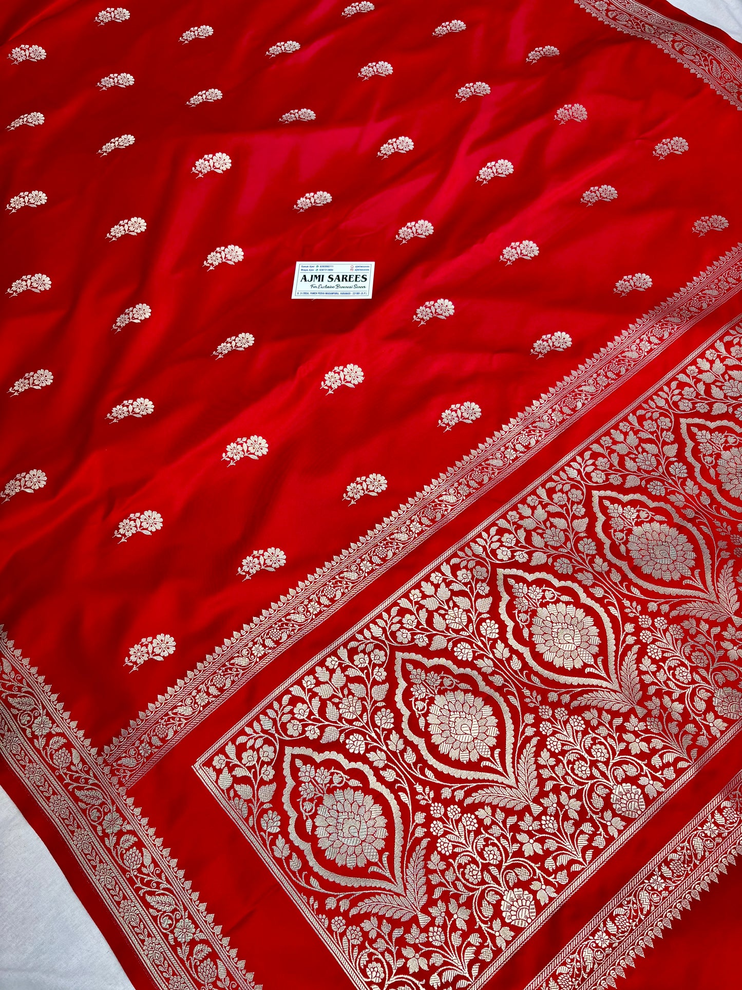 Red Banarasi saree with textured Tanchoi blouse