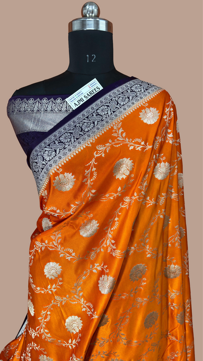 Mashru Katan Silk Orange Banarasi Saree with Contrast Violet Border and Rich Zari Floral Weaving