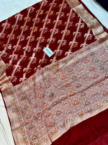 Maroon Banarasi saree with traditional floral Tilfi weaving