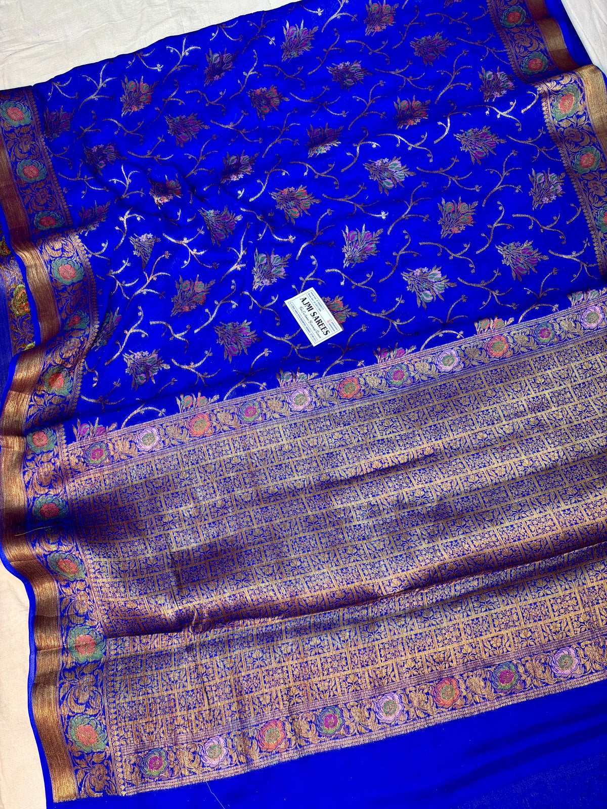 Royal blue Banarasi saree with antique copper zari and floral motifs