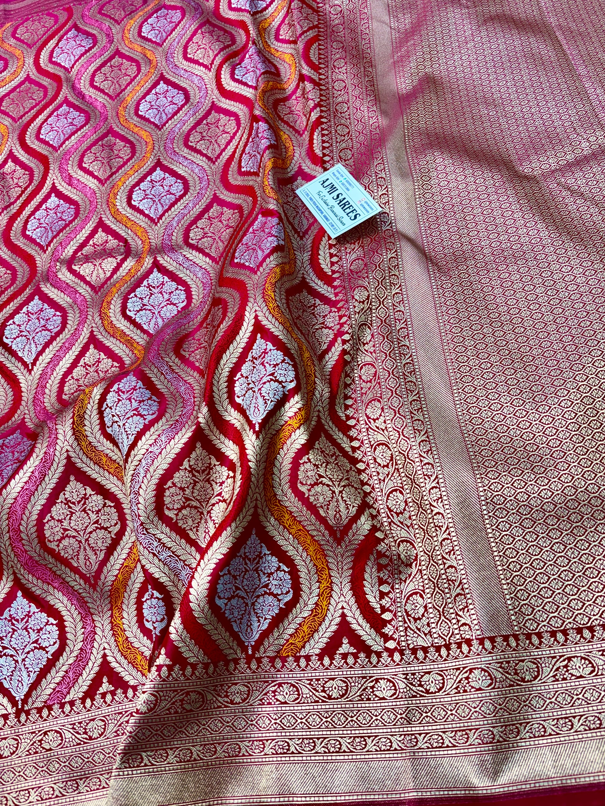 Dual tone pink Banarasi silk saree with rich floral zari motifs and designer border