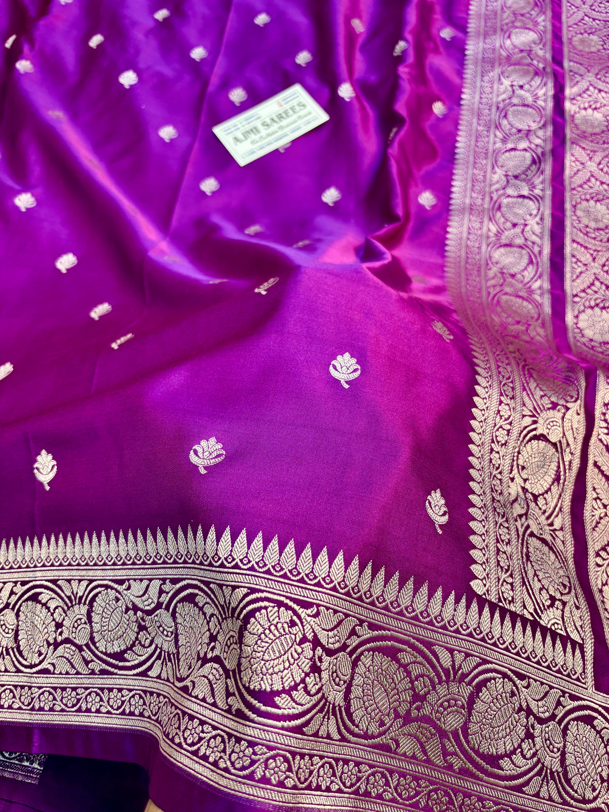 Magenta Banarasi silk saree with all-over golden zari butis