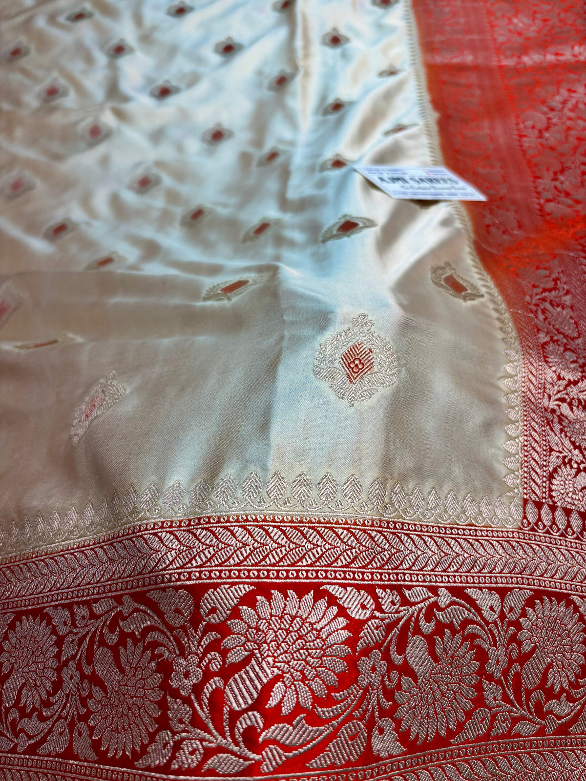 Luxury Premium Ivory Mashru Katan Silk Banarasi Saree with Contrast Orange Border & Meenakari Motifs Banarasi Saree