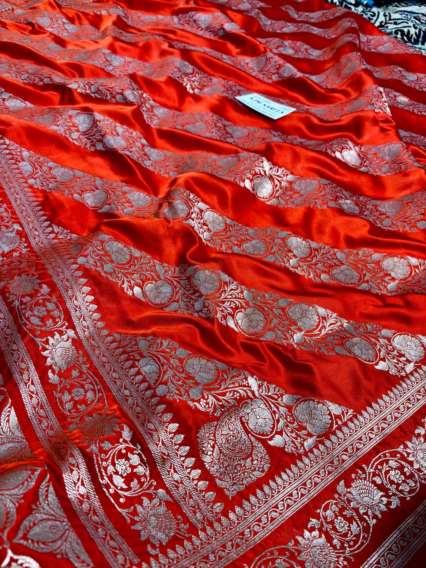 traditional orange banarasi silk saree zari motifs