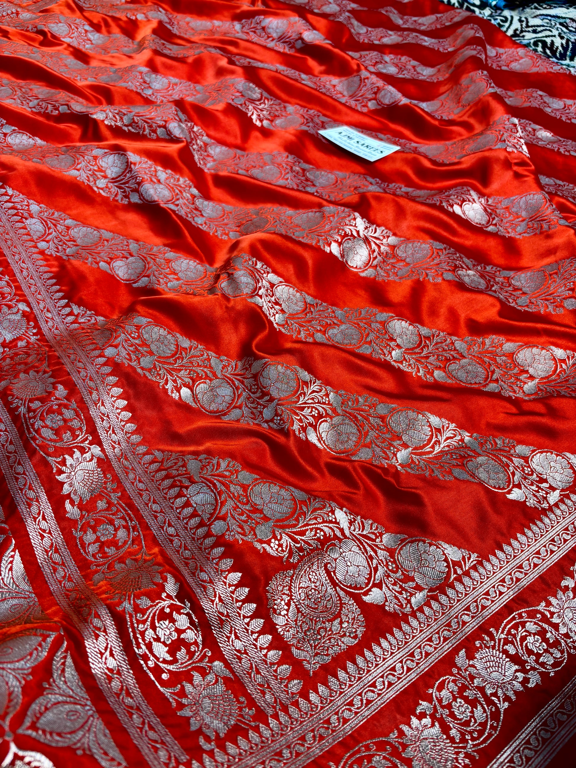 traditional orange banarasi silk saree zari motifs