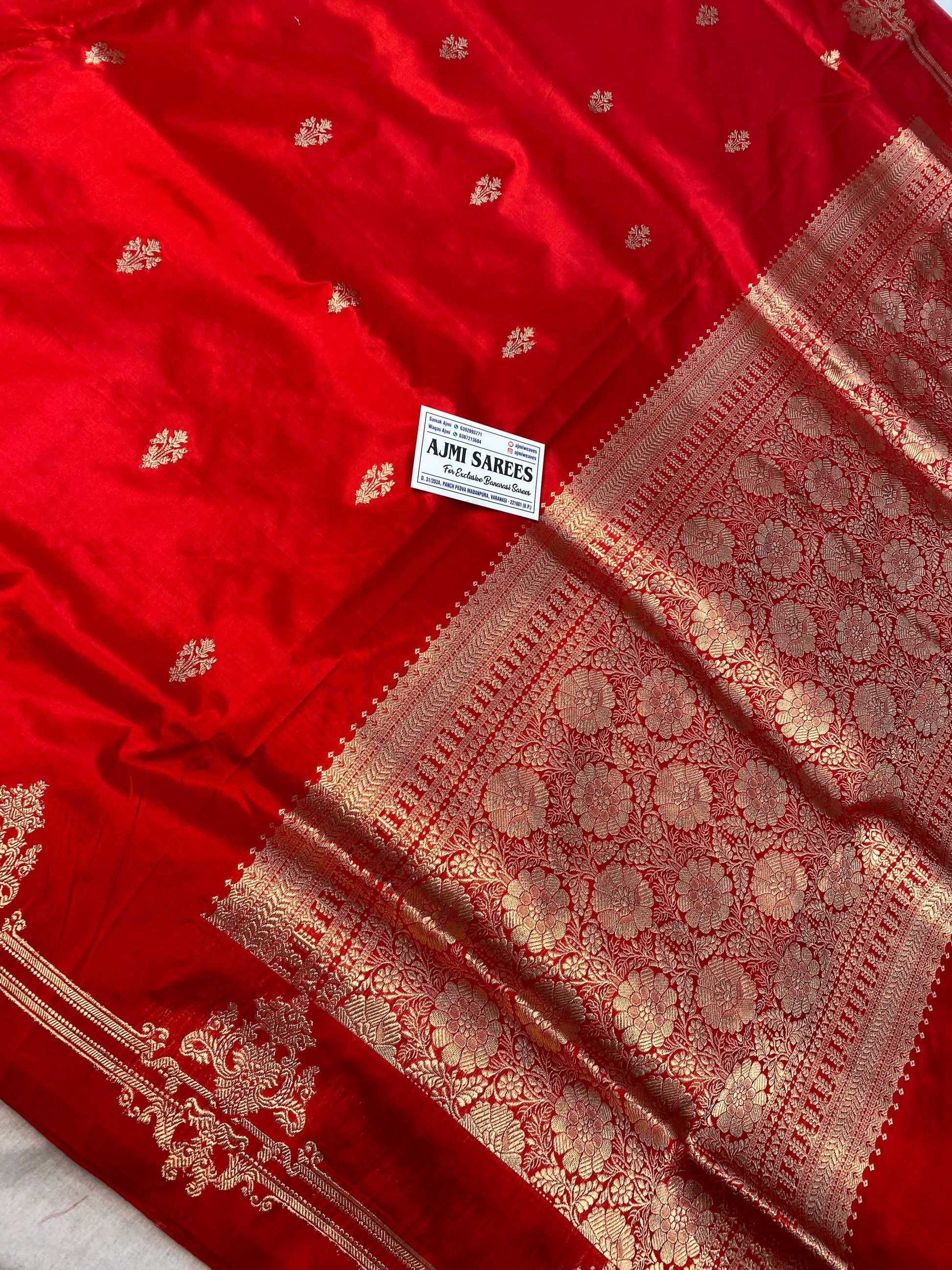 Red handloom Banarasi saree with Kadwa motifs and striped blouse piece