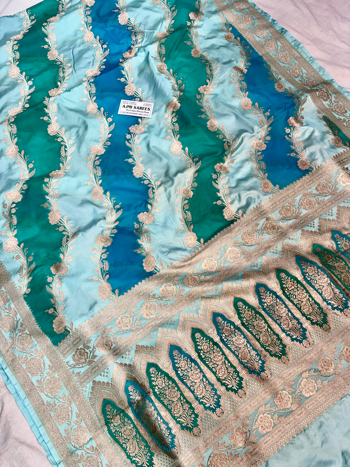 Detailed Banarasi zari border on sea green and peacock blue Rangkat silk saree