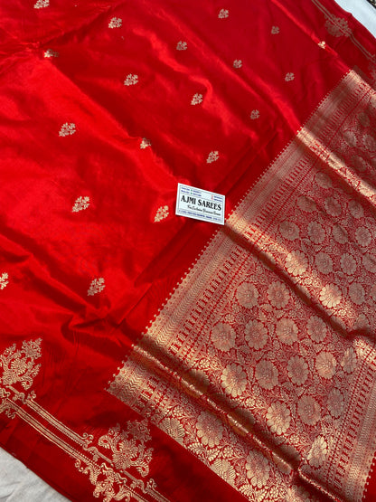 Pure Katan silk Banarasi saree with red body and ornate zari pallu