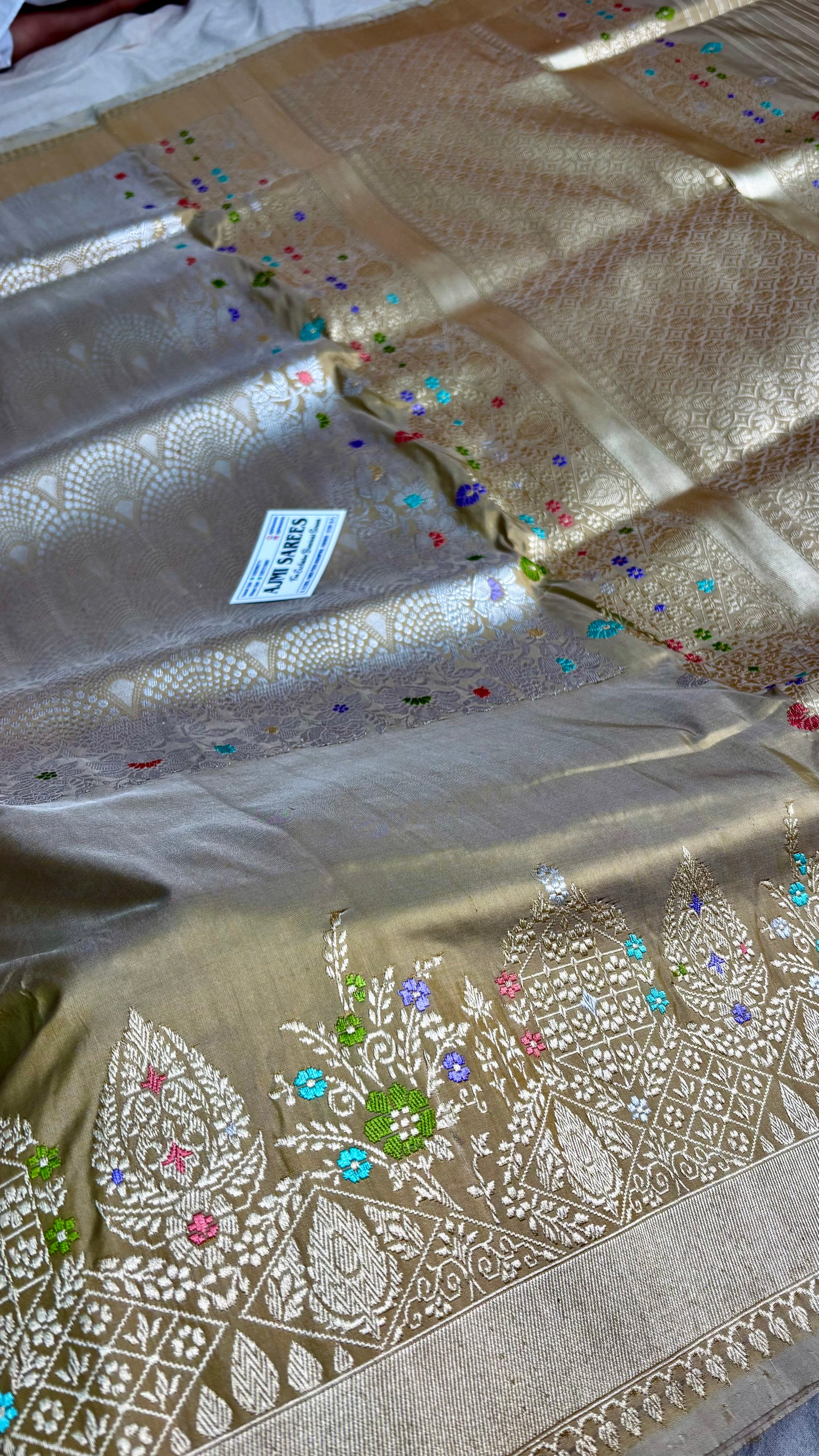 Handwoven Katan silk Banarasi saree with silver zari Tanchoi brocade and colourful Meenakari details
