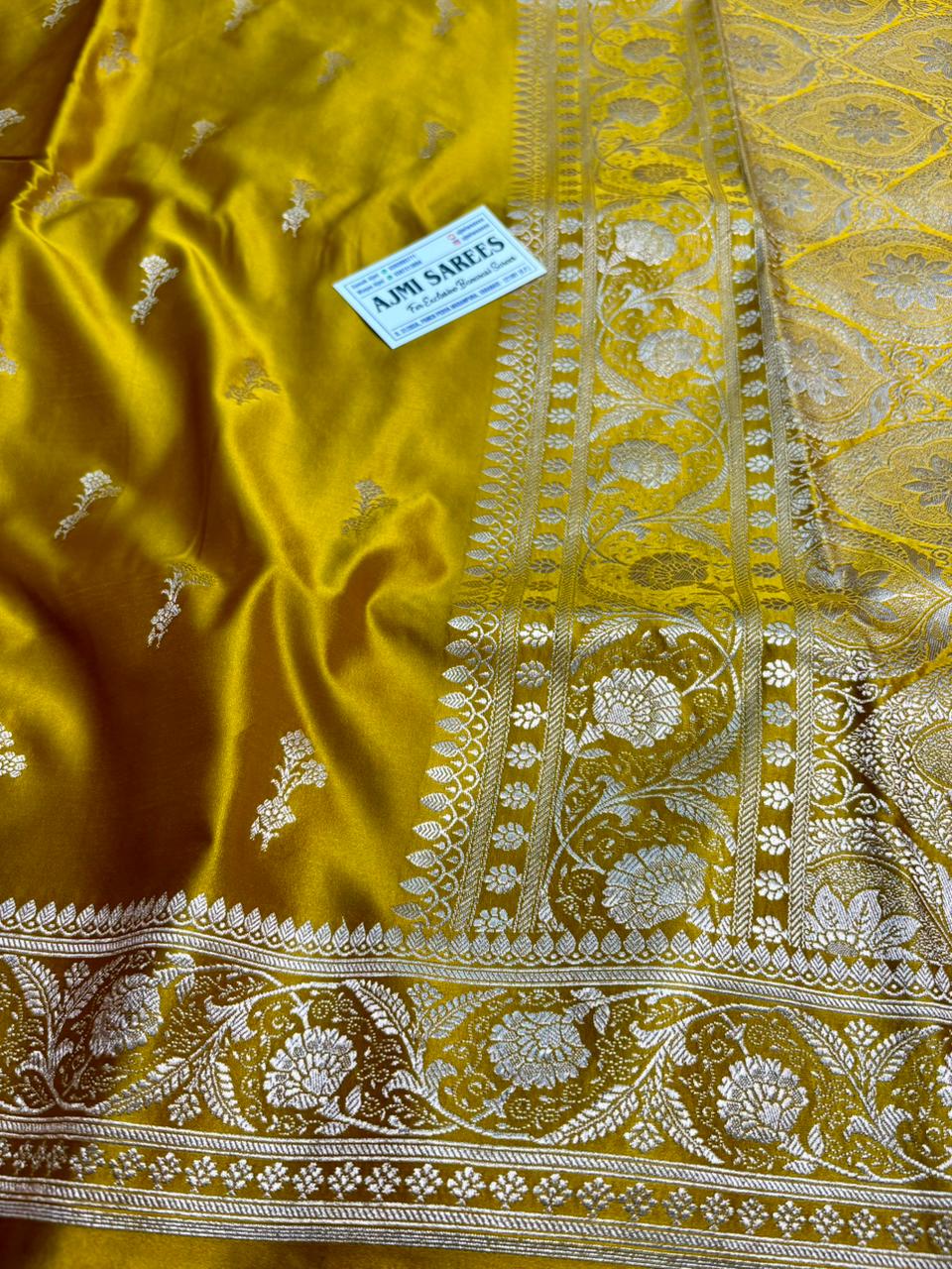 traditional mustard yellow banarasi saree with floral zari border