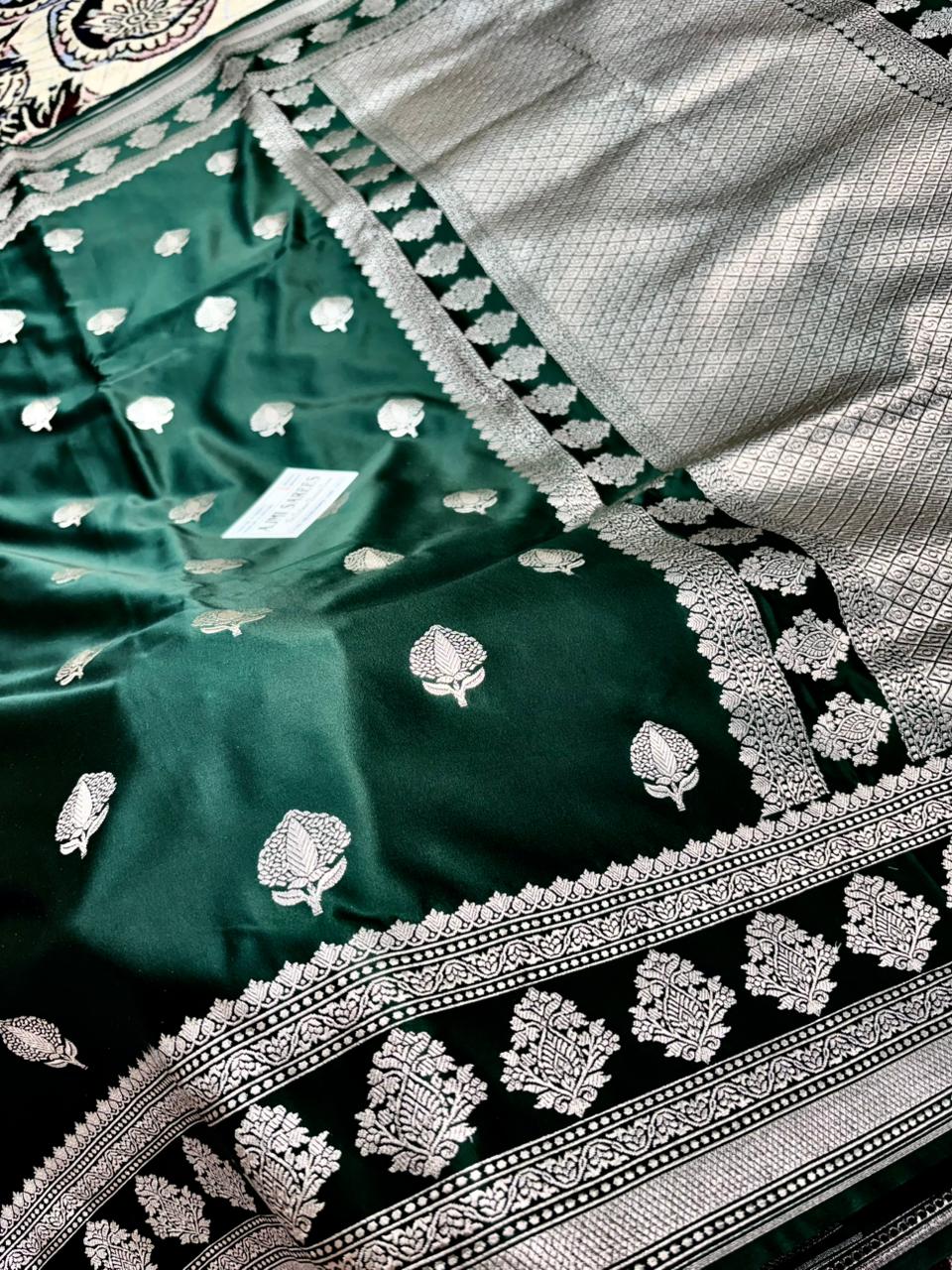elegant bottle green banarasi saree with traditional zari border