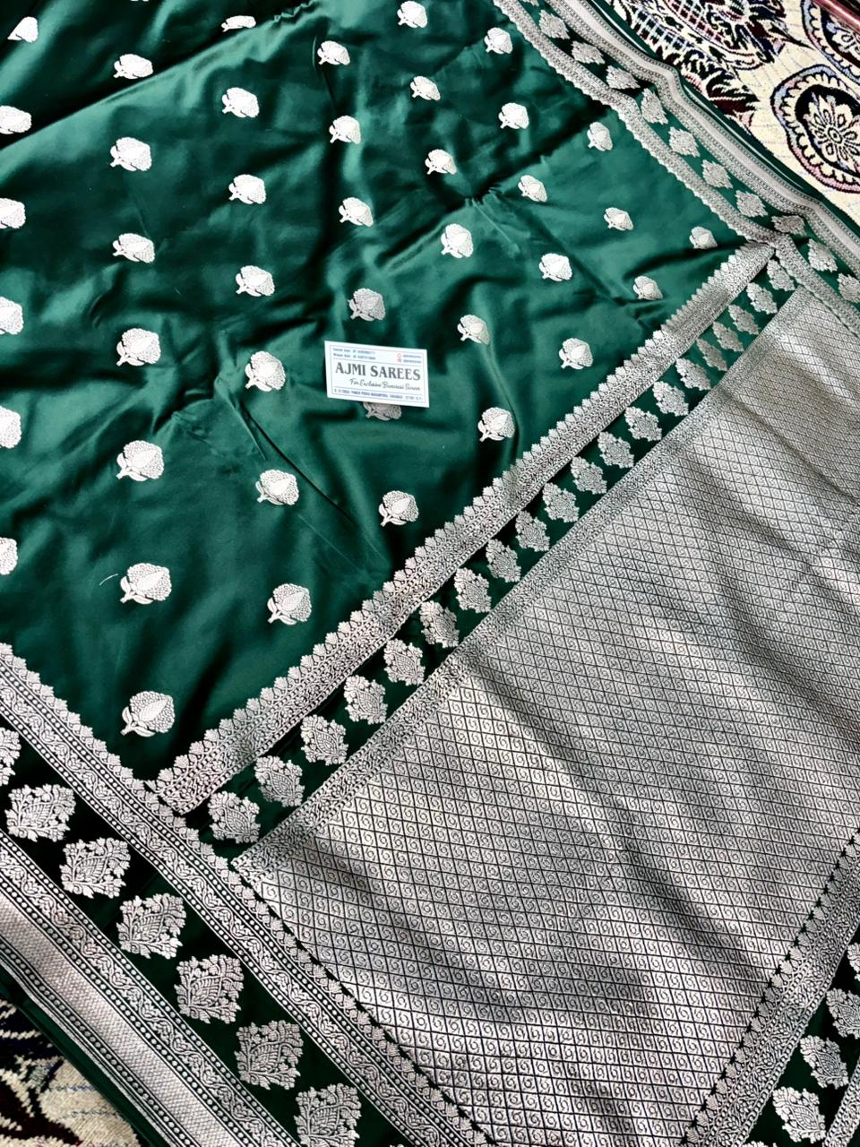 traditional bottle green banarasi saree with floral zari motifs